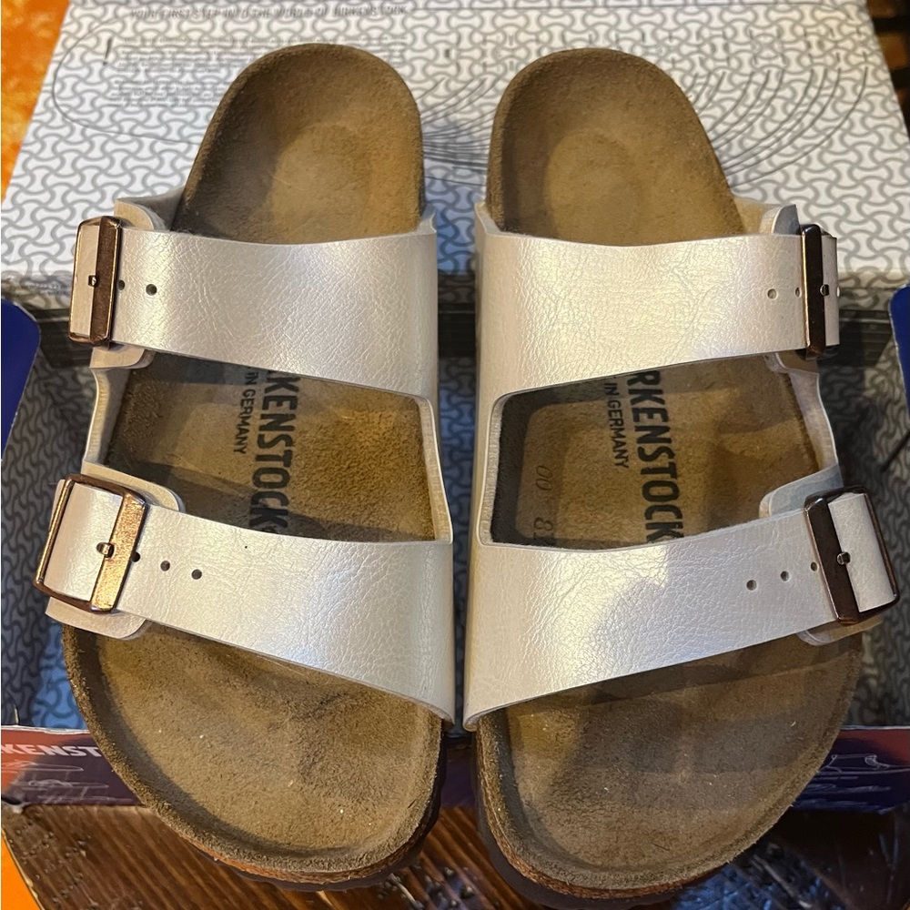 Pearl white Arizona Birkenstock’s, size 36, new and in box.